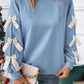 BLUE BOW SWEATER